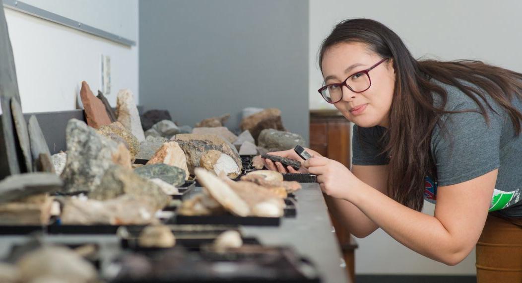 student studying rocks in classroom